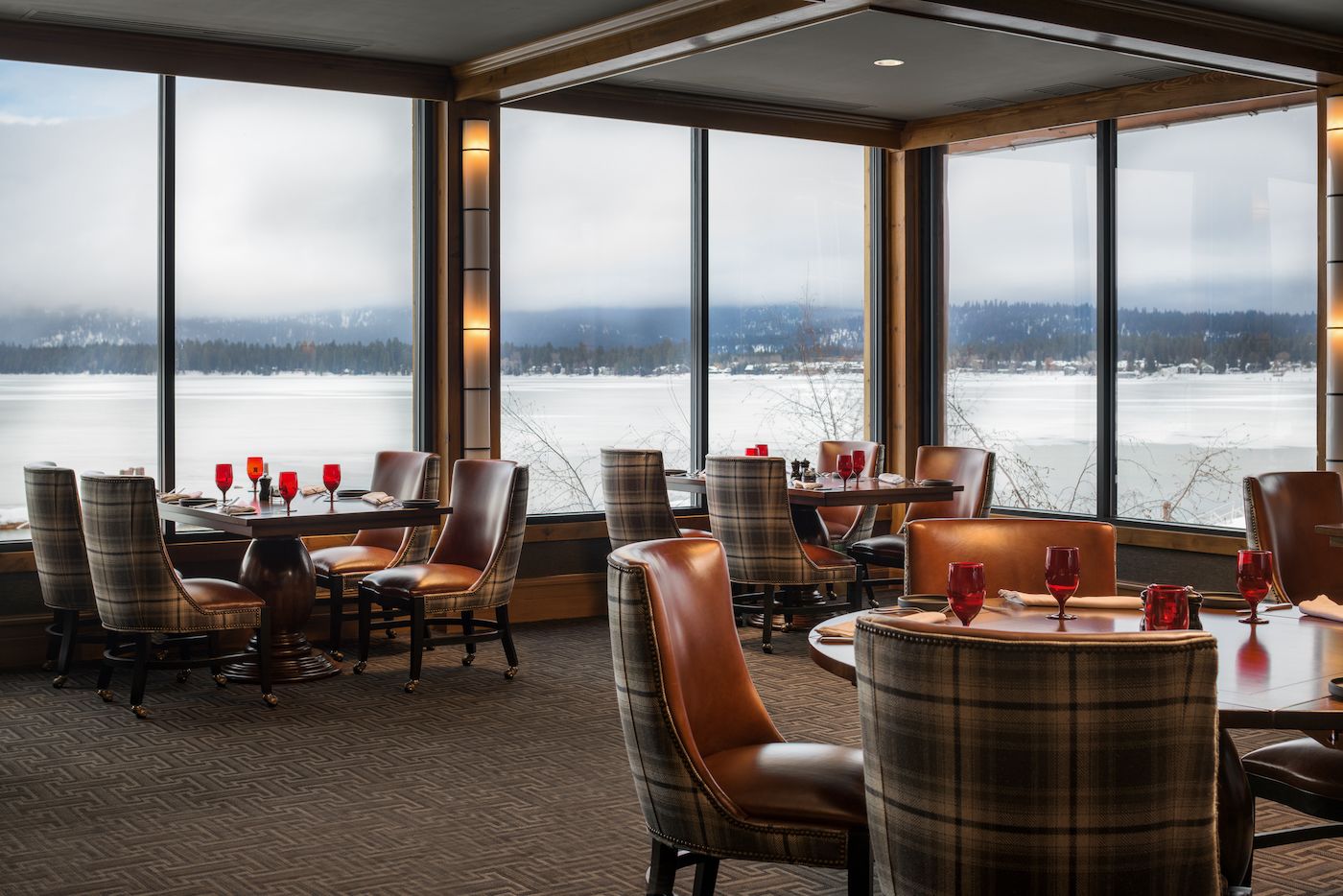 Dinning room of The Narrows Steakhouse during the winter overlooking a frozen Payette Lake